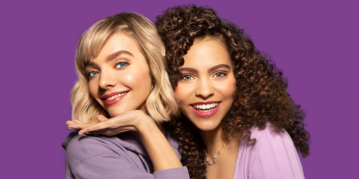 Women smiling enjoying colored contact lens trial